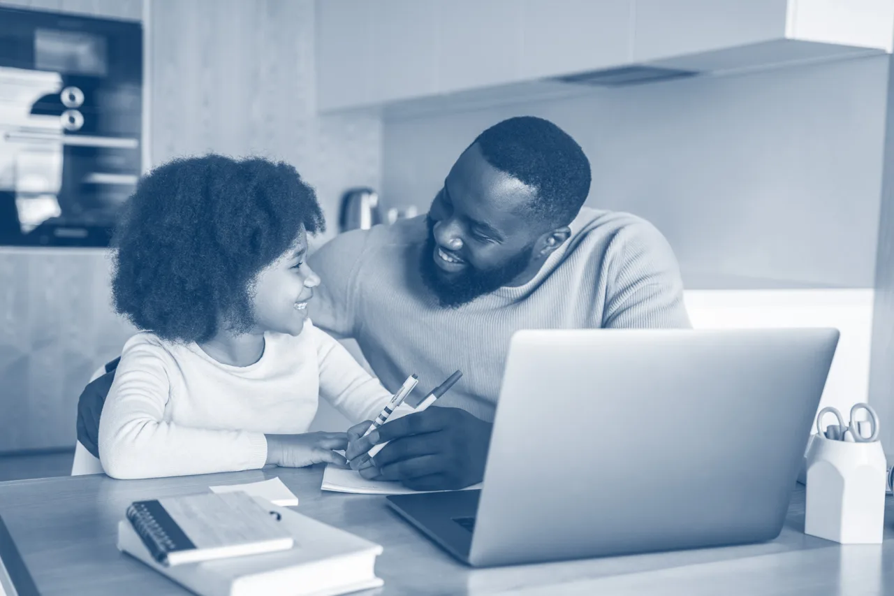Father and Daughter Doing Homework Together